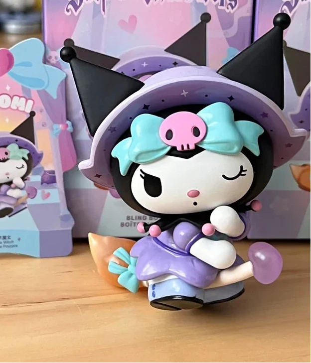 Colorful toy figure with black hair and a pink bow on a wooden surface
